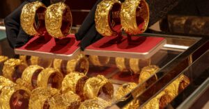 Gold extends gains on softer dollar; investors eye US jobs data