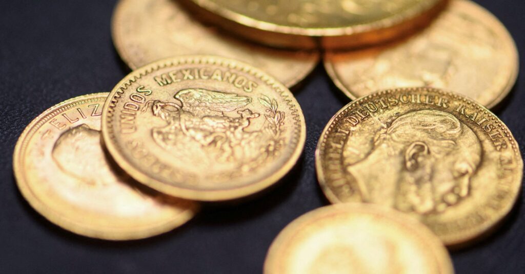 Gold drops over 1% as thin trading, profit‑taking weigh