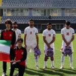 Iranian soccer players hold schoolbags in solidarity with slain girls