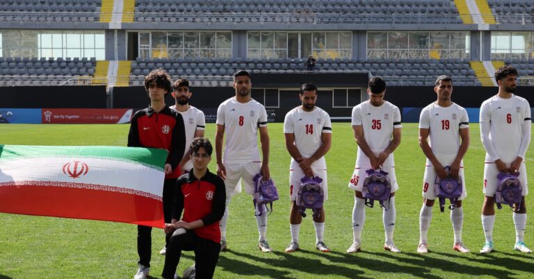 Iranian soccer players hold schoolbags in solidarity with slain girls