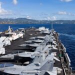 US carrier Ford, deployed in war with Iran, to go to port temporarily after fire